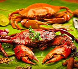 A tasty spicy crab fried served on a banana leaf, seasoned with spices,and prepared for consumption