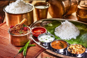 An assortment of rice, vegetables, and spices displays authentic flavors in various dishes.