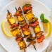 A platter of skewers with a variety of meat and veggie combinations that are perfect for grilling